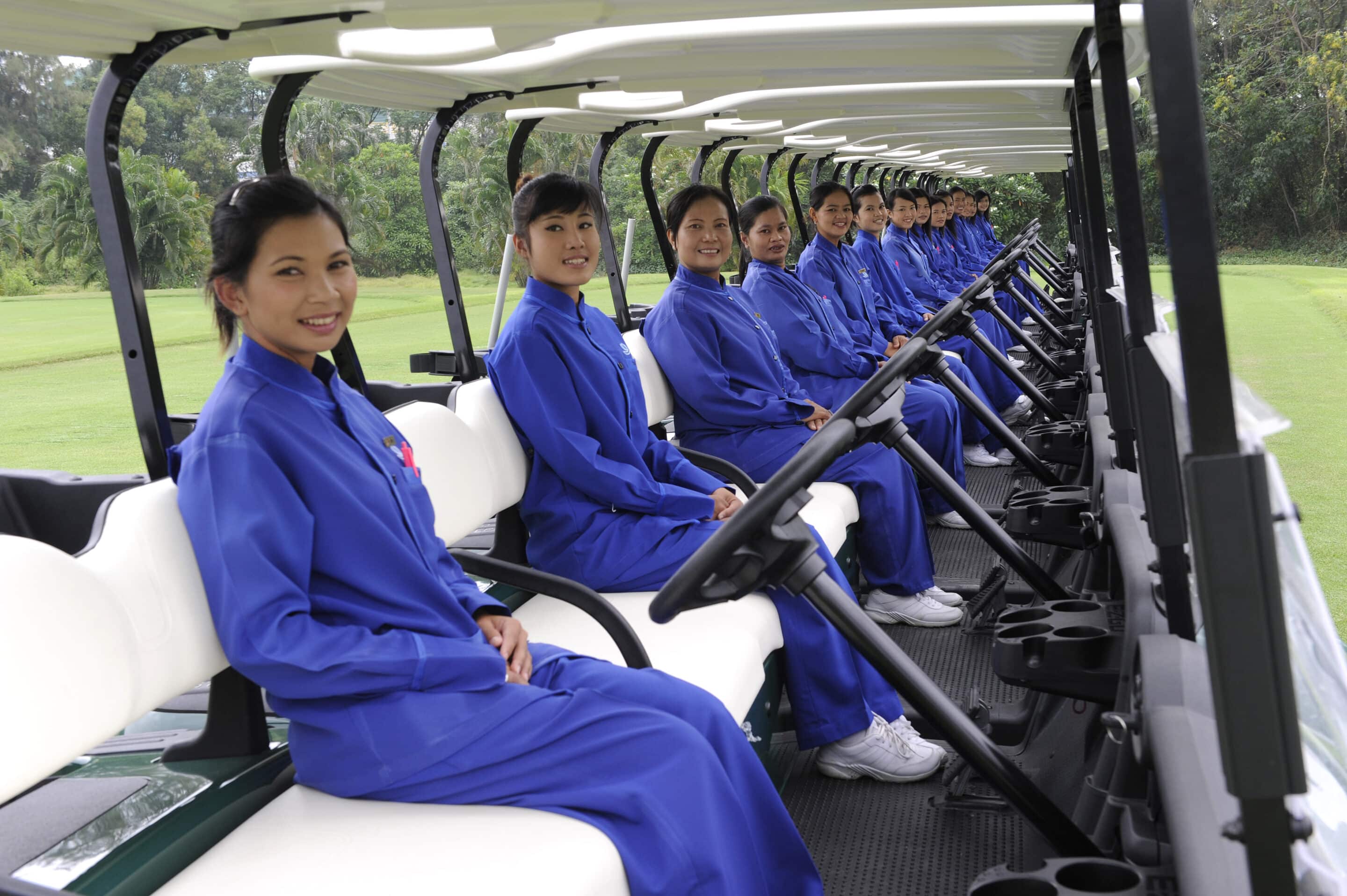 Thai golf caddies on a Phuket course